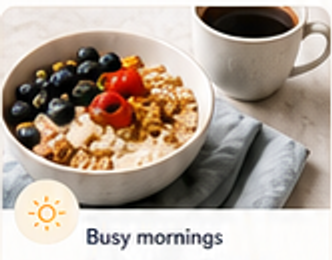 Breakfast bowl with berries, oats, and coffee.